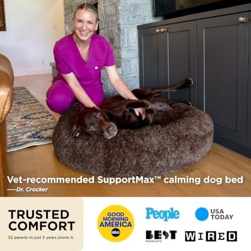 Calming faux fur donut dog bed